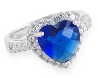 Кольцо с синим камнем в сверкающем окружении